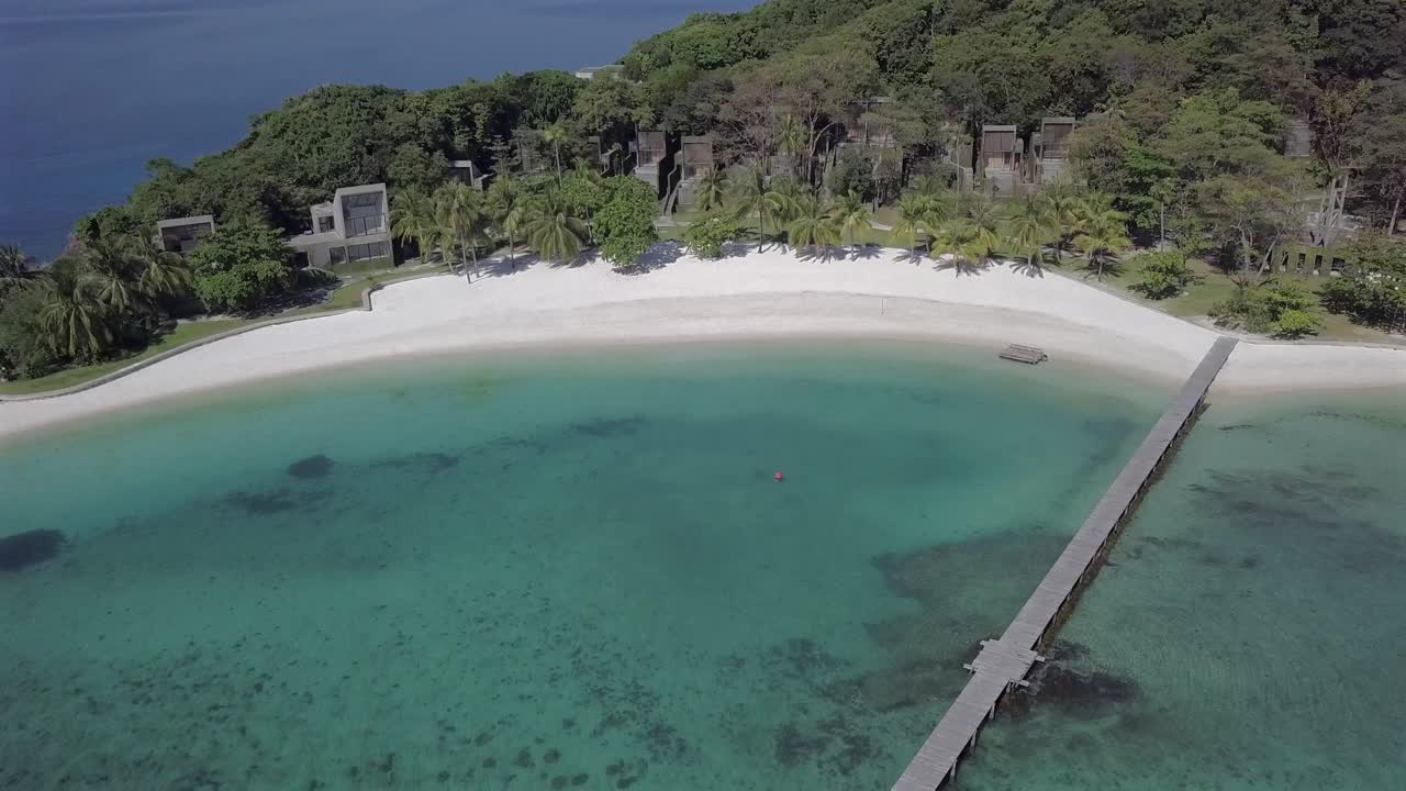 Aerial view of paradise island Koh Kham,Thailand backwards from the resort by the beach towards open sea.
