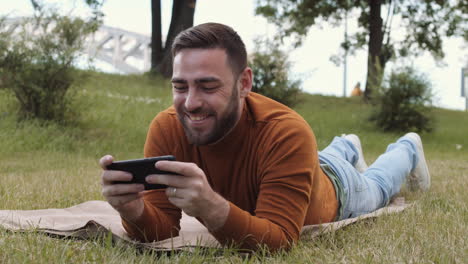 man taking phone call on lawn