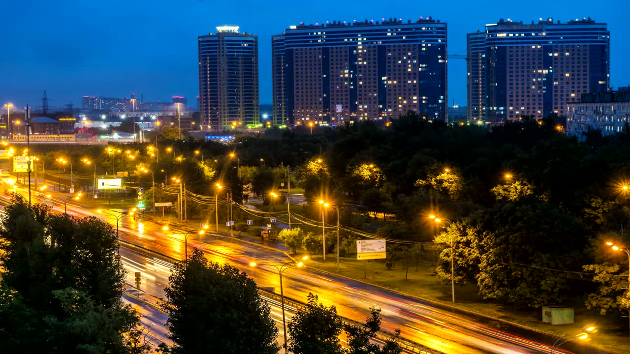 night panoramic view of traffic and Windows of houses on the outskirts of the metropolis, time lapse