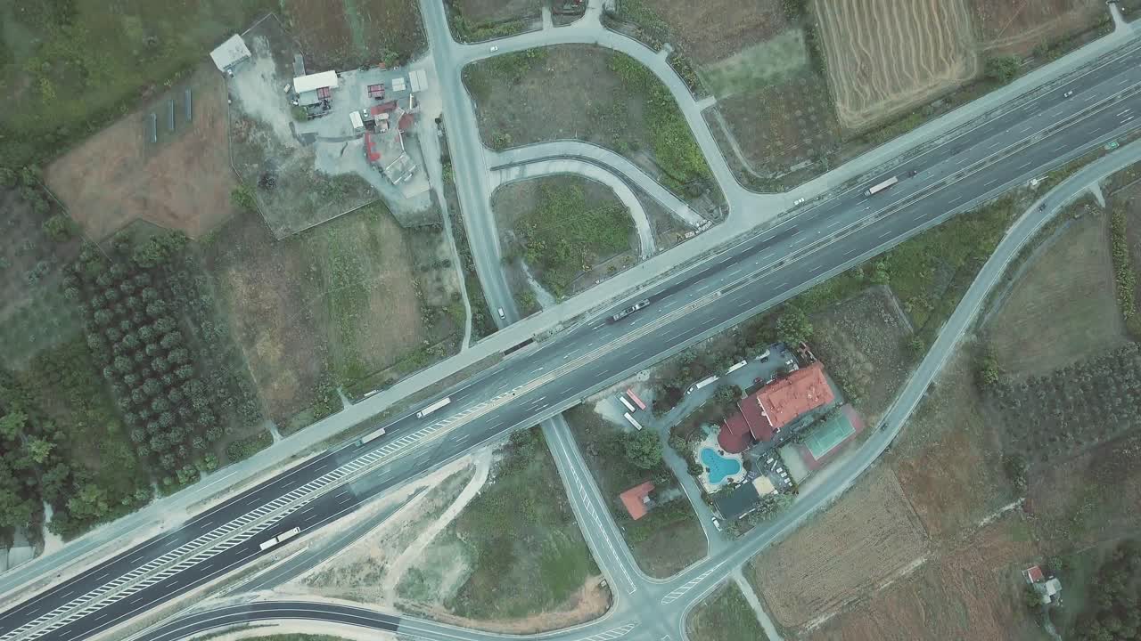 Aerial view of a highway and surrounding landscape