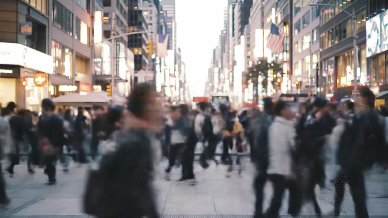 A Dynamic Urban Scene Depicting a Bustling Crosswalk Filled with a Diverse Crowd of Pedestrians in Motion Against a Vibrant City Backdrop