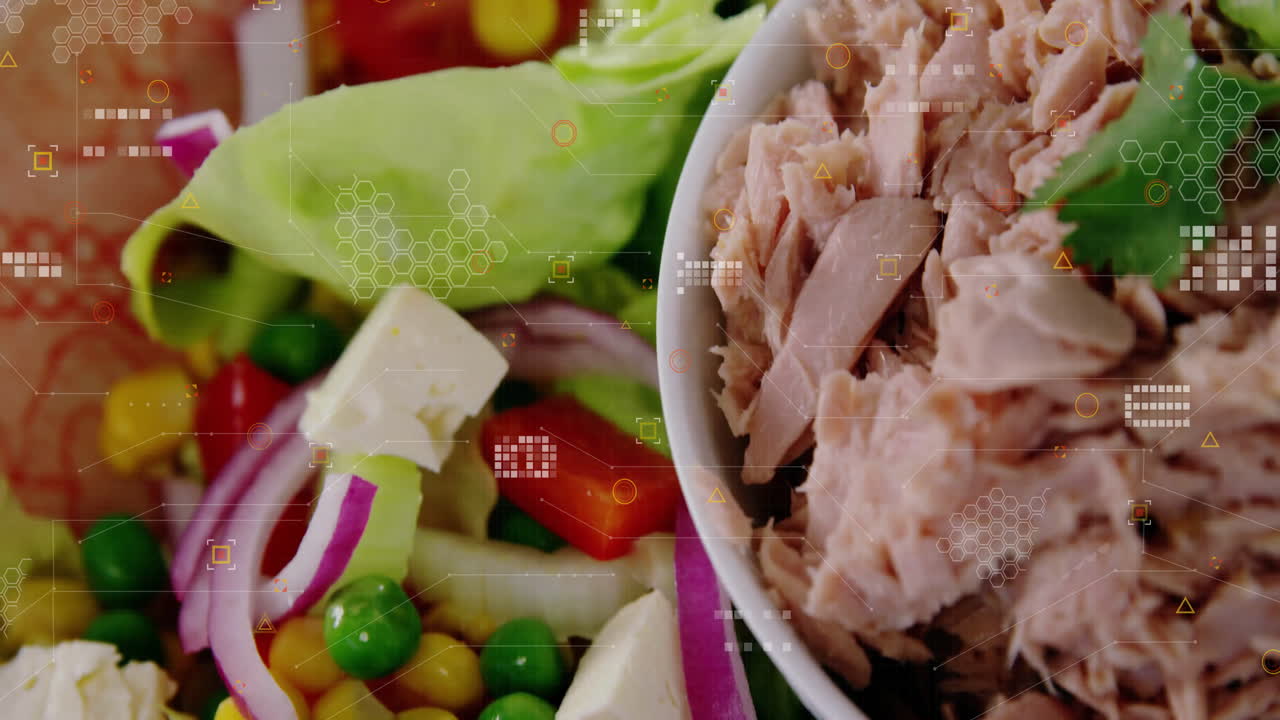 Tuna salad with vegetables and digital data processing animation overlay