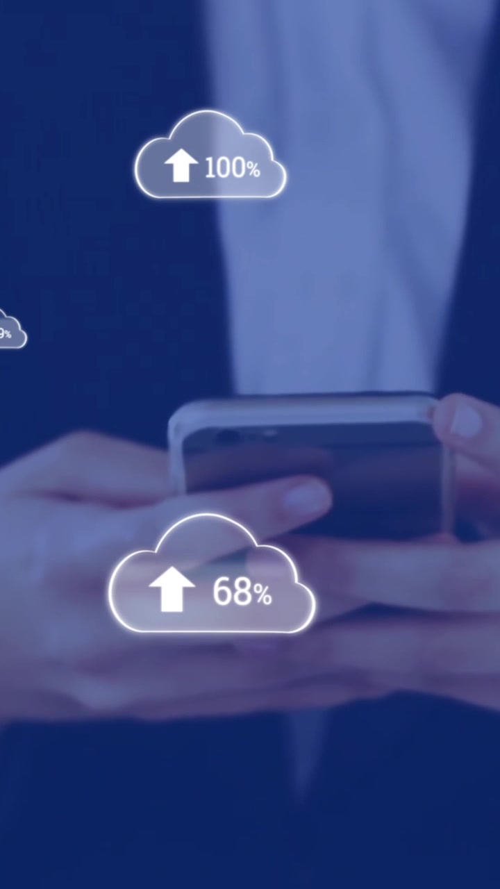 Animation of cloud icons with growing number over caucasian businesswoman using smartphone