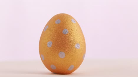 golden easter egg with silver polka dots