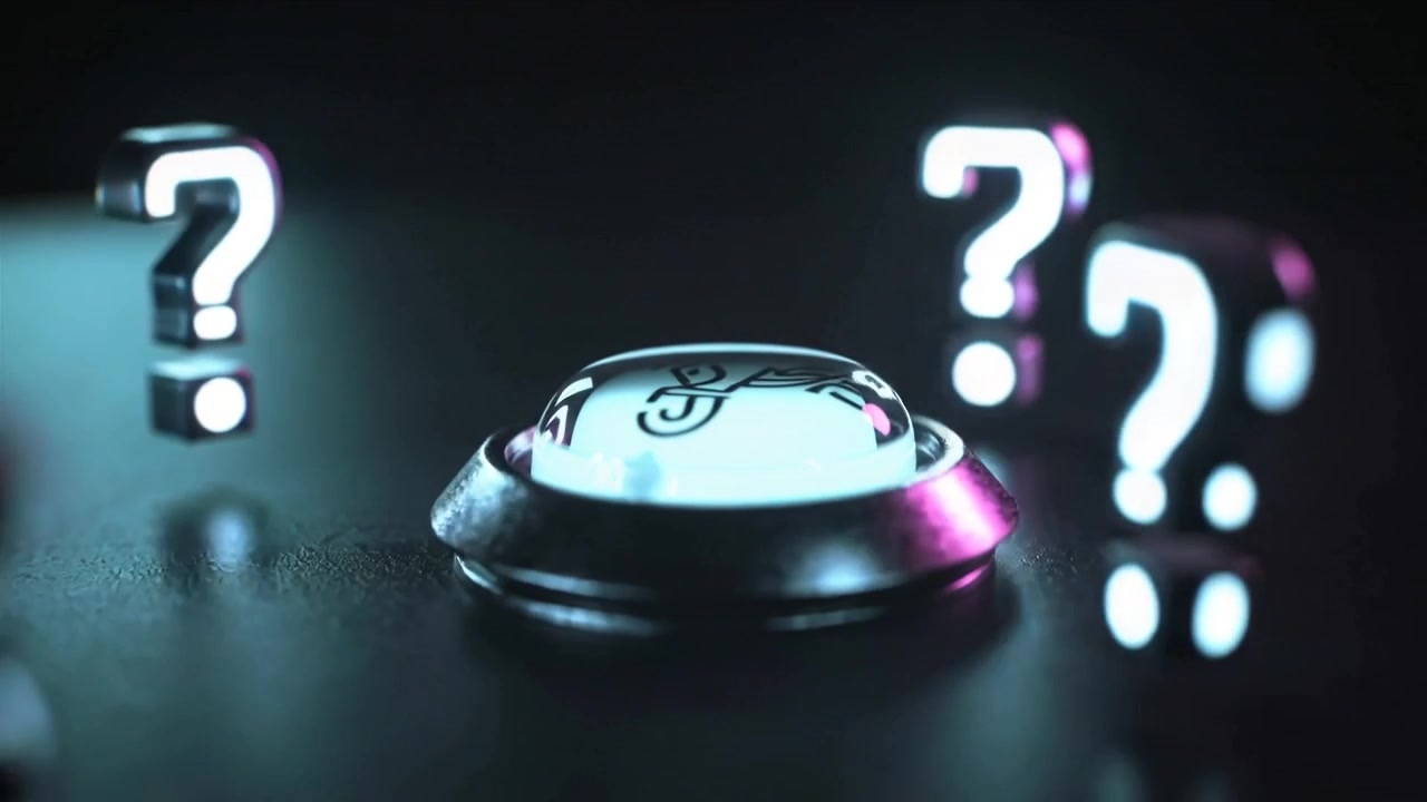 Moving camera bringing domed button and hovering question-mark into focus at studio to show symbol