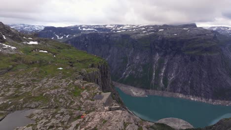 scenic aerial view above mountaineous landscape of famous trolltunga hike in odda, norway