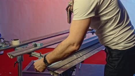 worker using a metal cutting machine for construction work