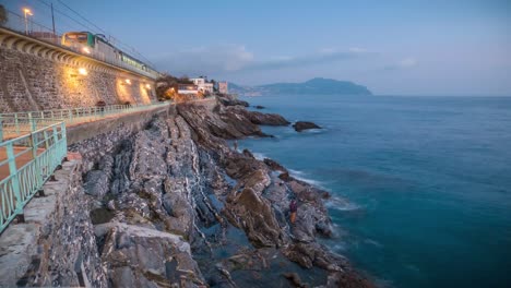 view of a walk near the sea in italy. also near a train station and people walking