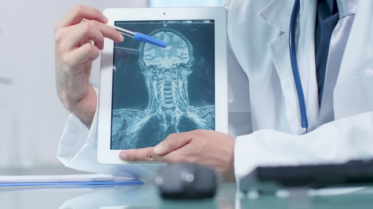 Doctor Showing MRI Scan on Tablet
