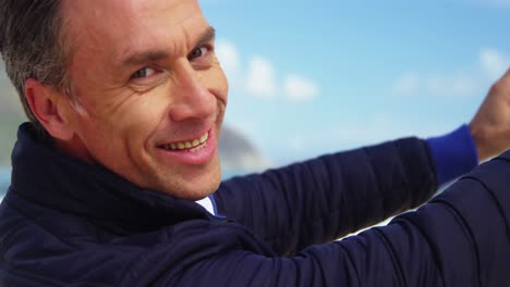 mature man taking picture of view from mobile phone