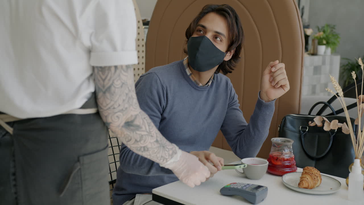 Cafe Customer Paying with Phone