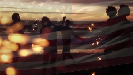 Animation-of-waving-flag-of-usa-over-group-of-friend-having-fun-on-the-beach