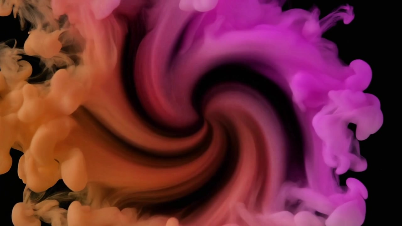 Remolino abstracto de tinta naranja y rosa en el agua