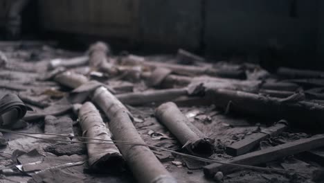 old rotten pipes are in an abandoned building among the garbage