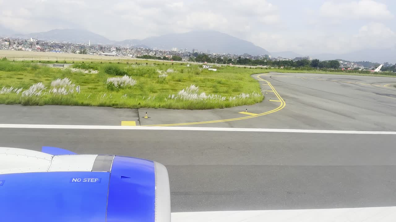Footage of the runway at Tribhuvan International Airport in Kathmandu, Nepal, featuring aircraft movements, aviation activity, and travel scenes at the country’s main international air gateway