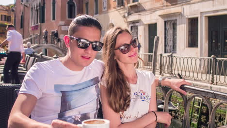 couple enjoying coffee in venice, italy