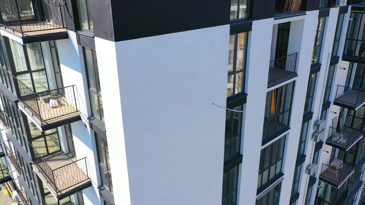 City modern building on aerial view. Contemporary residental building in the city.