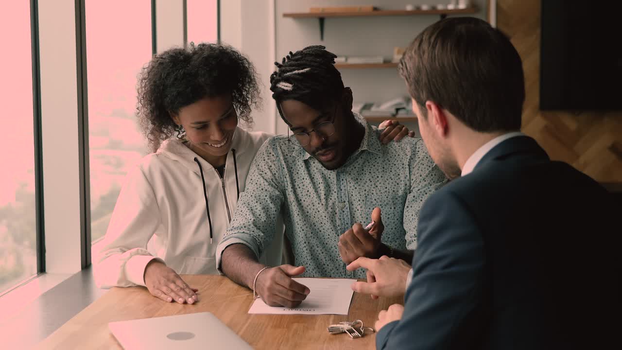 African couple sign agreement receive keys from new bought home