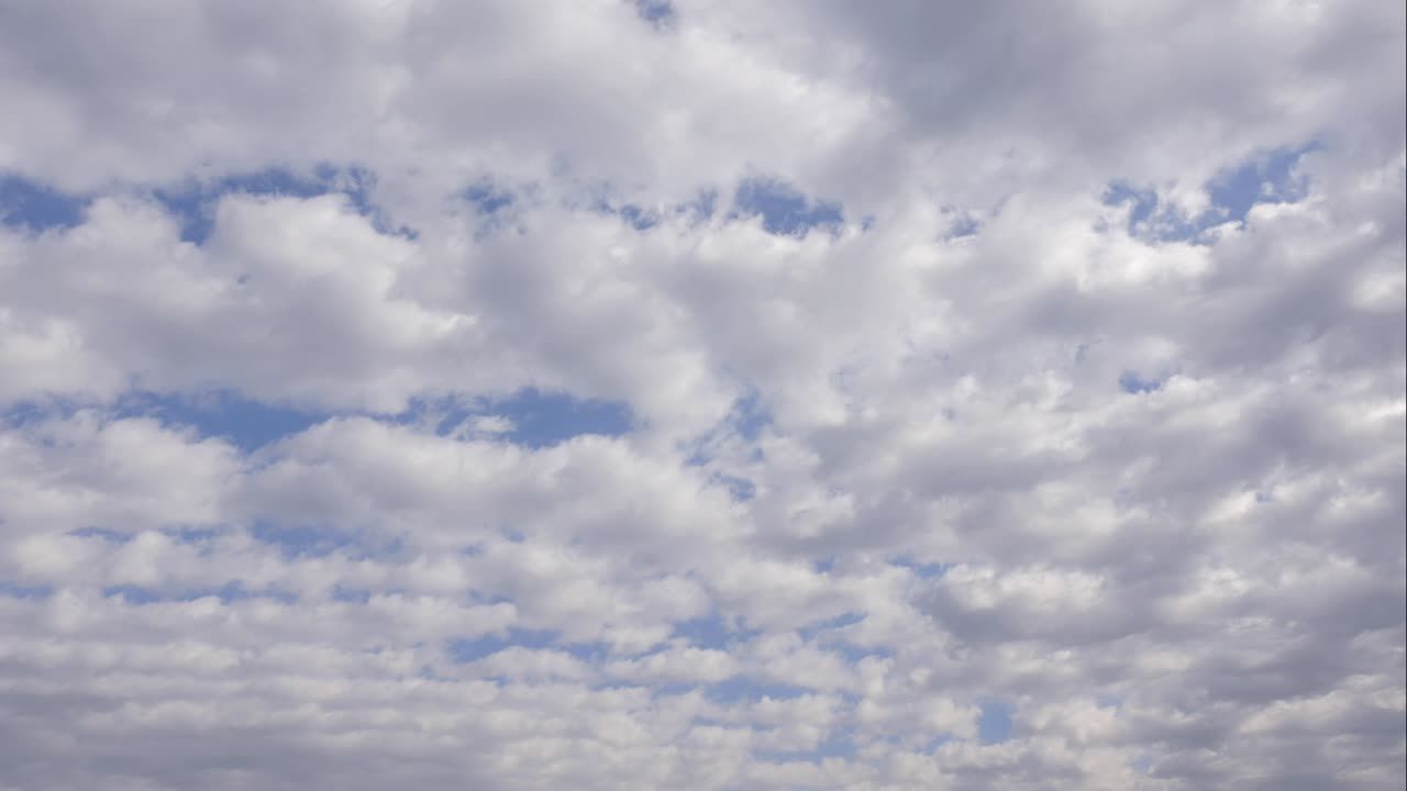 Blue sky white clouds. Puffy fluffy white clouds. Cumulus cloud scape timelapse. Summer blue sky time lapse. Dramatic majestic amazing blue sky. Soft white clouds form. Clouds time lapse background