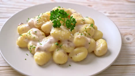 gnocchi with mushroom cream sauce and cheese - italian food style