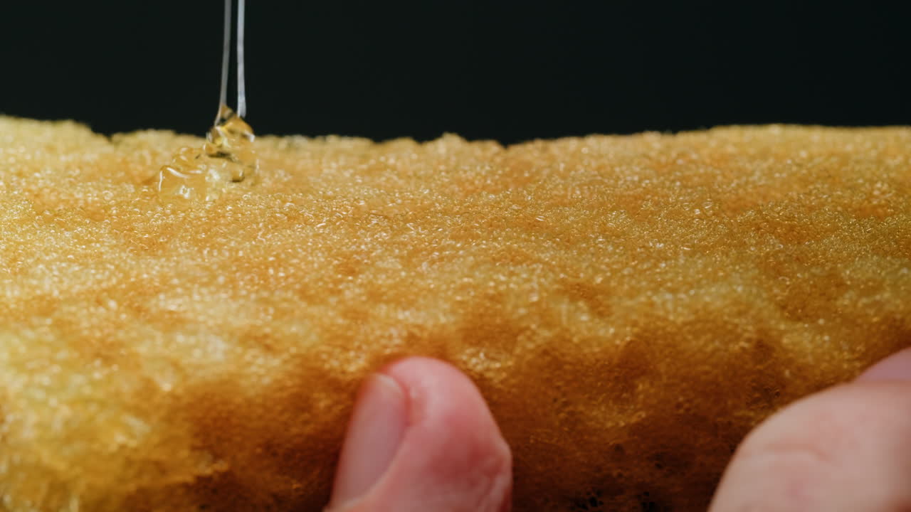 Closeup view of a yellow sponge with liquid
