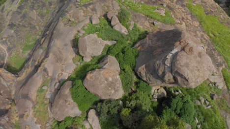 Aerial-birds-eye-view-of-amazing-granite-boulders-in-the-wild-of-tropical-East-Africa