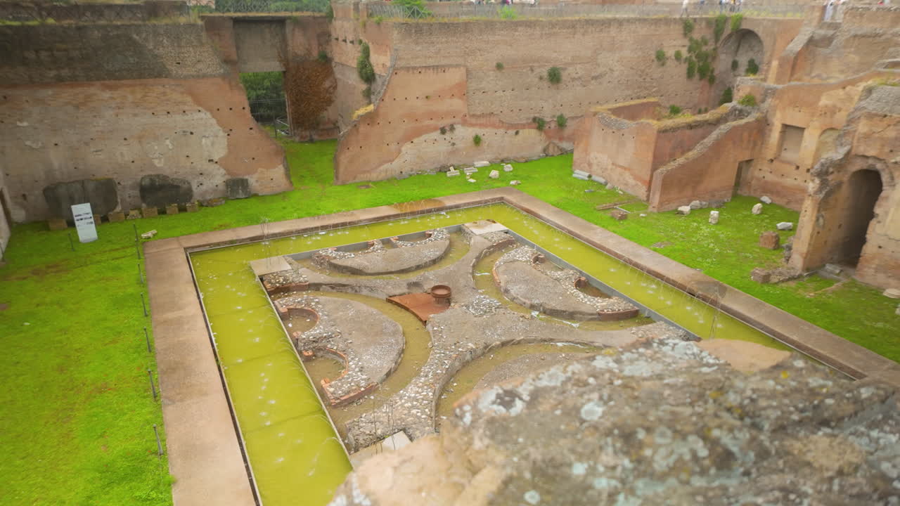 Scattered Roman stone relics among ruins with vegetation on a historical site