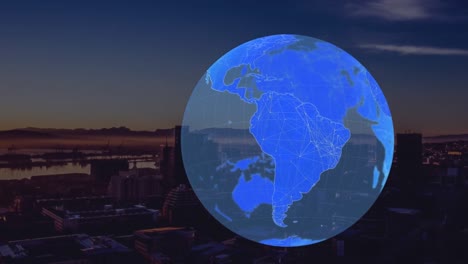 animation of globe spinning over cityscape