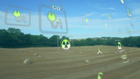 energy icons and environmental impact animation over rural landscape with hay bales