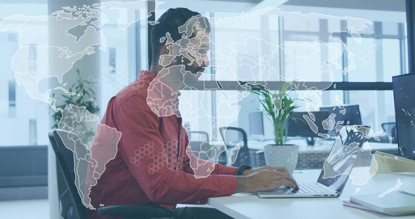 Professional typing laptop and showing animated world map overlay for data analysis jotting notes