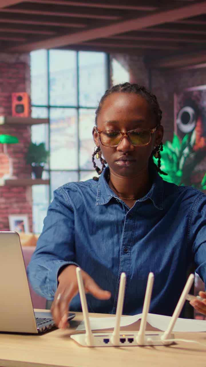 African American Woman Setting Up WiFi Router and Connecting to Internet