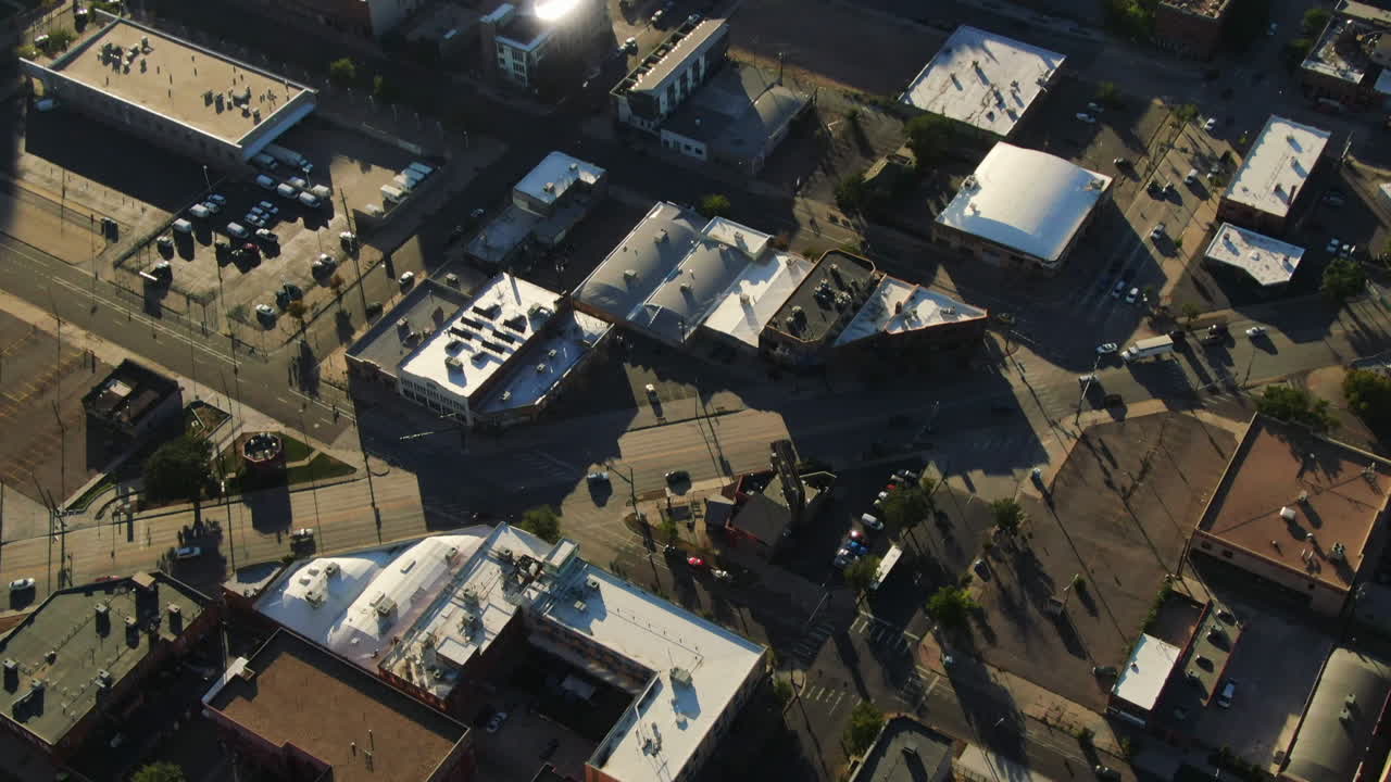 High angle drone tilt shot of cars driving over the streets in Denver