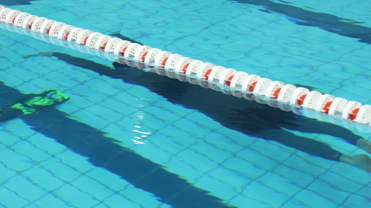 Indoor pool frediving competitor without fin
