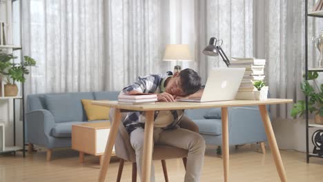 student sleeping at desk