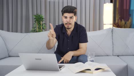 Tough-and-aggressive-young-man-looks-at-camera-angrily.