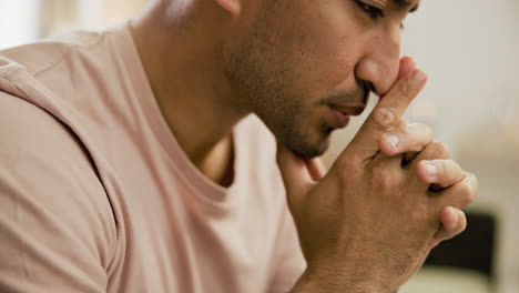 man in prayerful pose