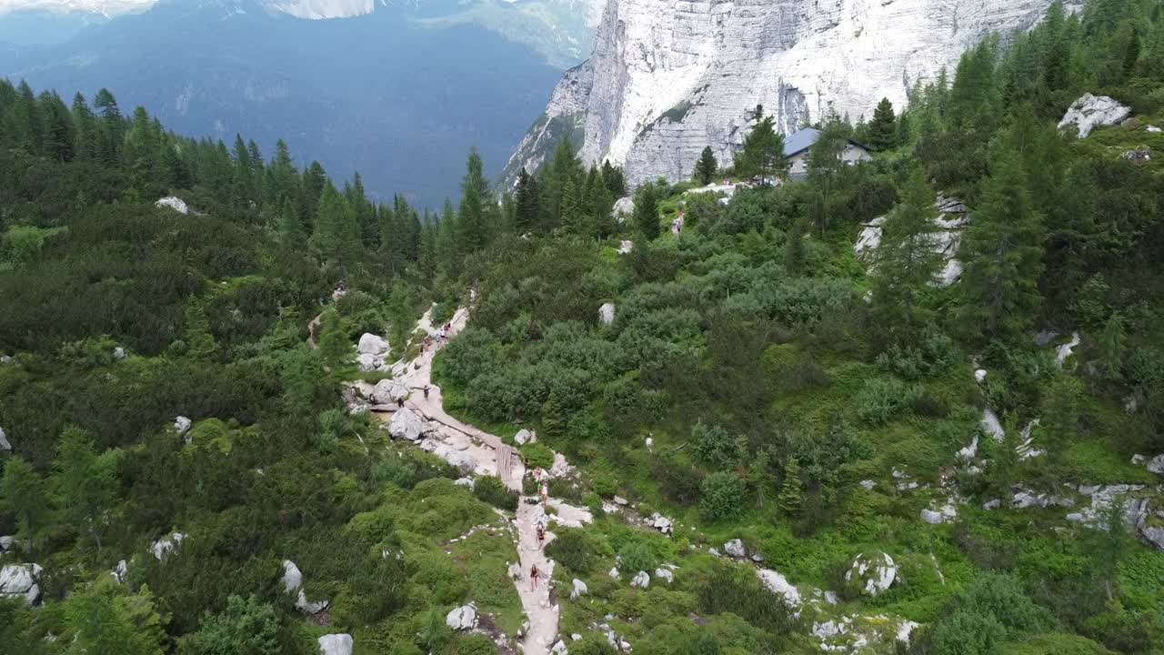 Aerial view of the stunning turquoise waters of Lago di Sorapis surrounded by alpine wilderness. Perfect for nature, travel, and hiking themes.