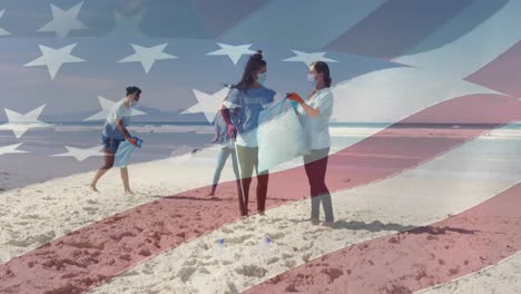 Animation-of-flag-of-united-states-of-america-over-people-in-face-masks-cleaning-beach