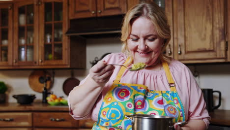 woman enjoying a meal in the kitchen