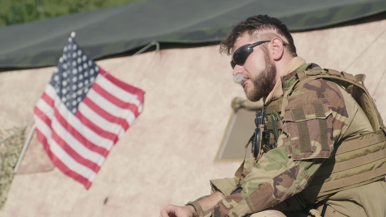 Military Man In Camouflage Smoking