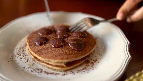 Cutting-into-a-delicious-home-made-pancake-breakfast-on-a-Sunday-morning