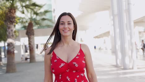 woman in a red floral dress outdoors