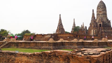 visitors explore ancient temple in ayutthaya, thailand