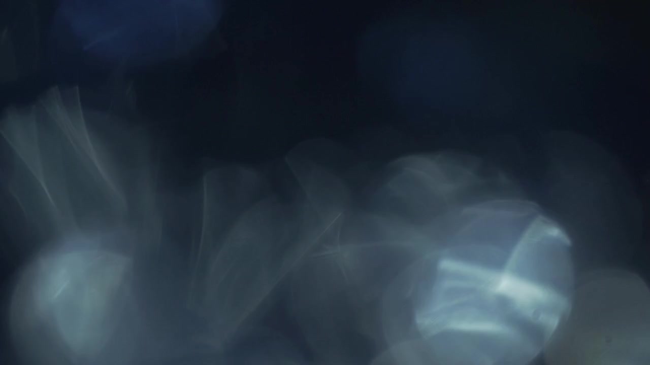 Ethereal Blue Light Leaks Fading on Dark Background