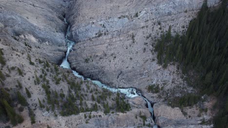 waterfall in the mountains approached creek above