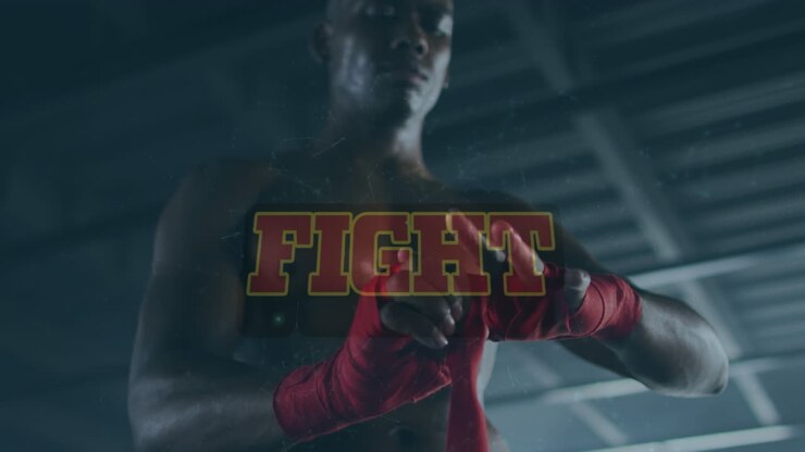 Animazione del testo "Fight" su un giovane uomo africano che si fascia la mano con una benda sportiva in palestra