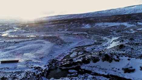 Amazing-Vast-Grey-Landscape-Covered-In-Snow-In-Iceland---aerial-drone-shot