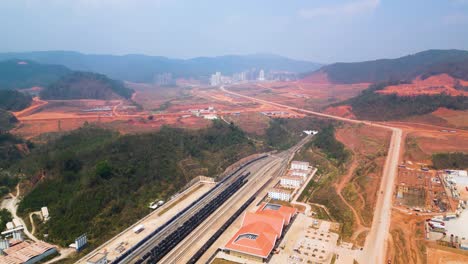 Aerial-shot-revealing-the-newly-constructed-train-station-in-Boten,-Laos