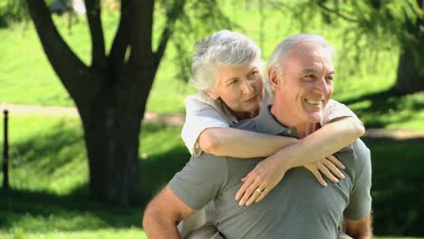 senior man carrying his wife