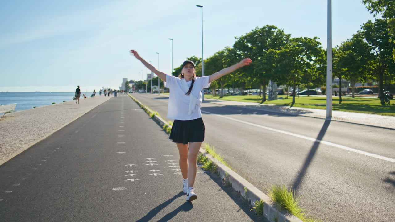 Active sportswoman walking road relaxing after running summer. Woman stretching